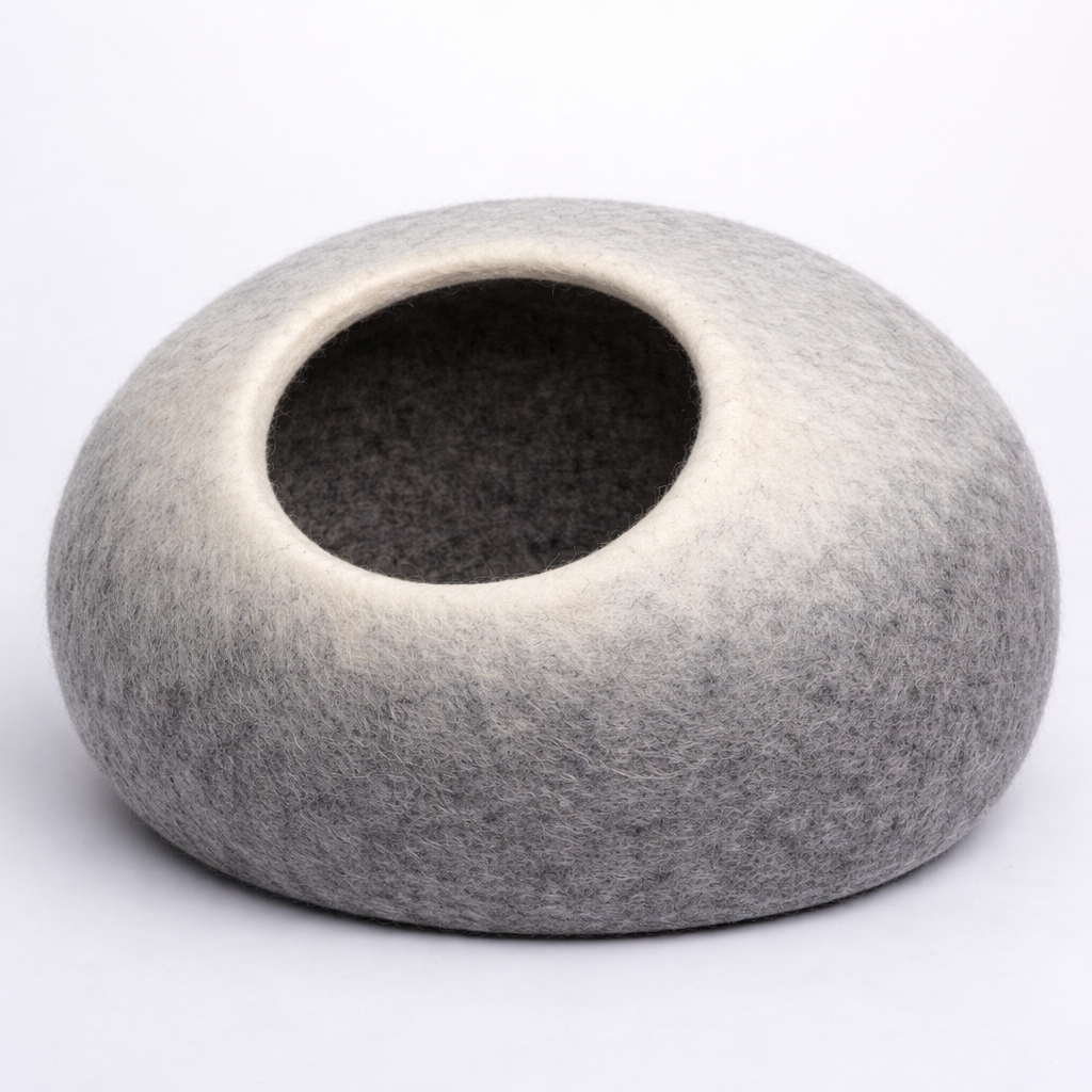 Gray felted pet bed on a white background