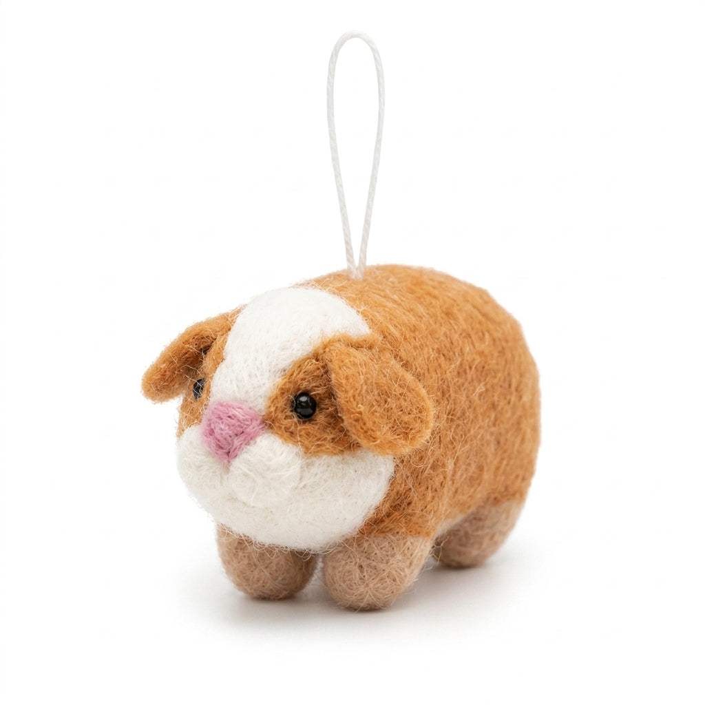 Tan and white wool felt guinea pig hanging ornament with a white belly on a white background