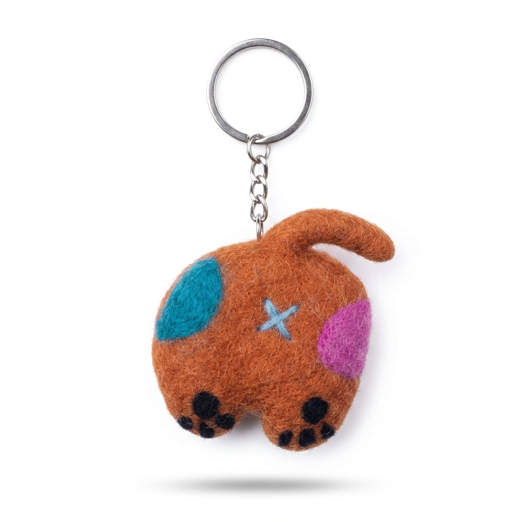 Caramel and brown wool felt cat back keyring on a white background