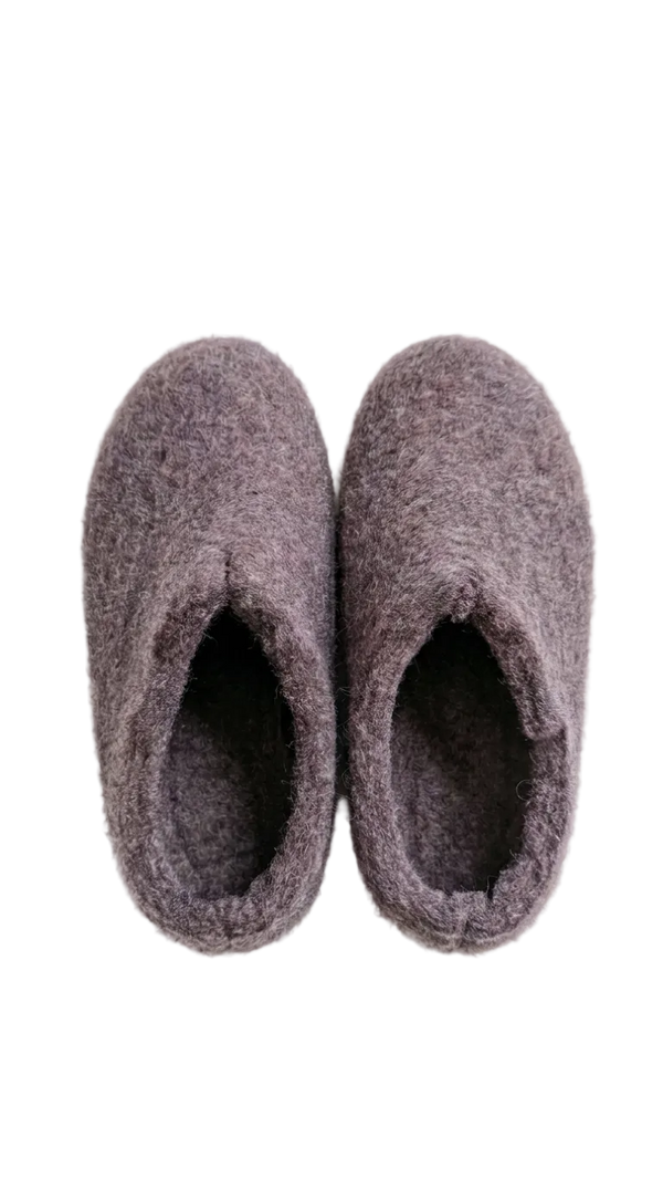 Pair of purple slippers on a white background