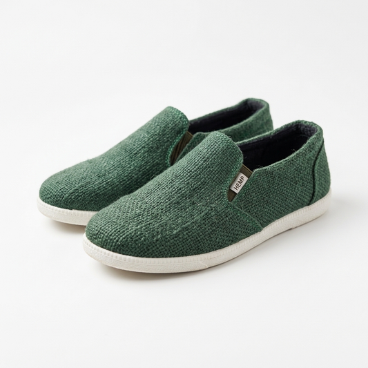 Handmade organic hemp canvas slip-on shoes in forest green with white rubber soles and brown brand tags