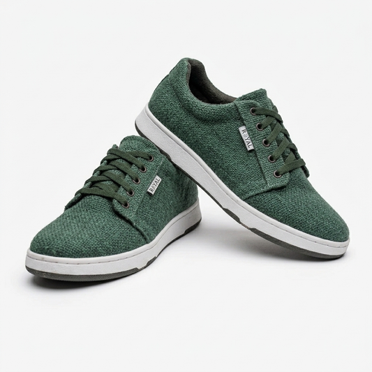 Handmade organic hemp green low-top sneakers with textured fabric uppers, matching laces and white rubber soles