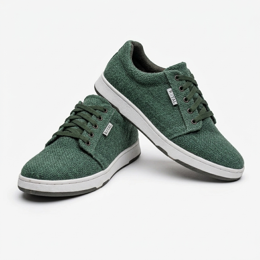 Handmade organic hemp green low-top sneakers with textured fabric uppers, matching laces and white rubber soles