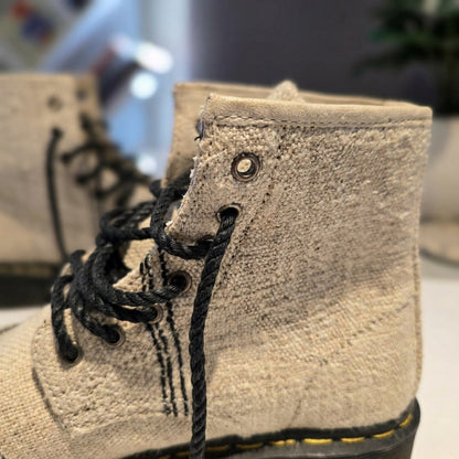 Close-up of a white hemp canvas texture handmade organic hemp footwear breathable vegan shoes on a blurred background