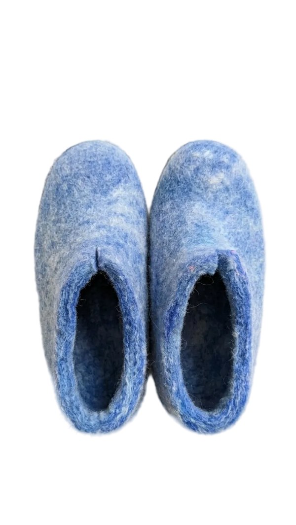Pair of blue slippers on a white background