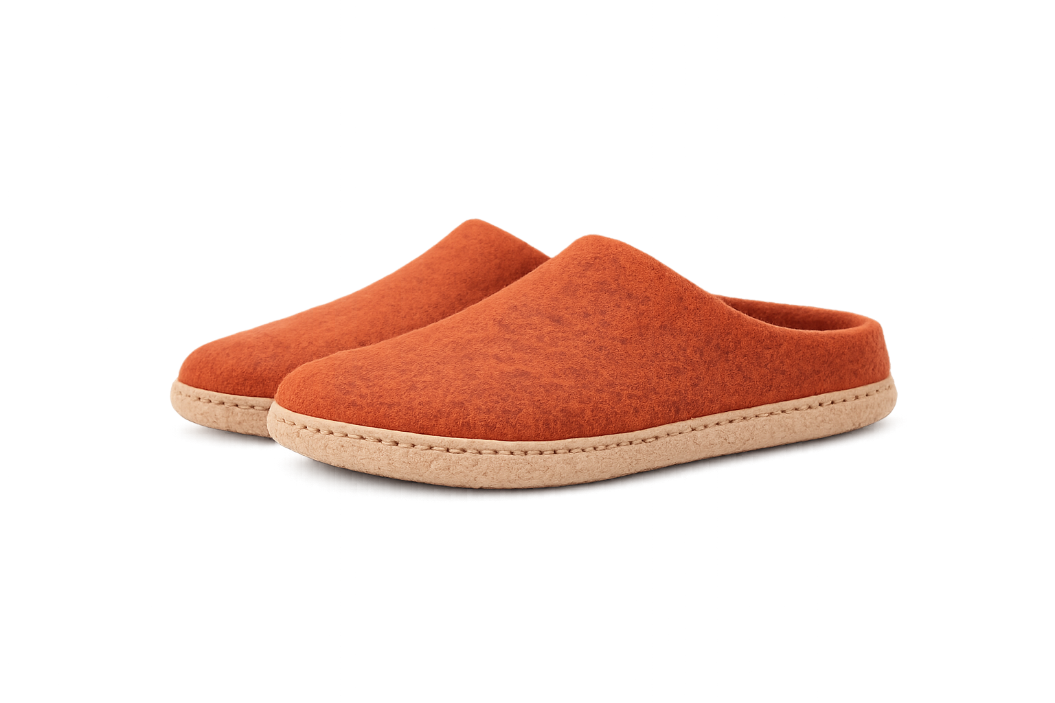 Pair of orange slippers on a white background