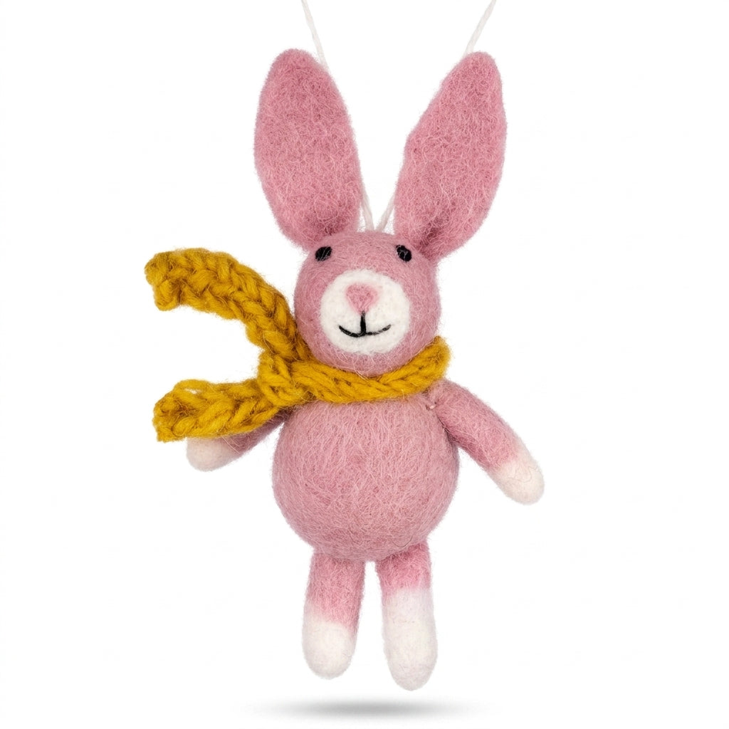 Pink bunny wool felt ornament with yellow scarf on a white background