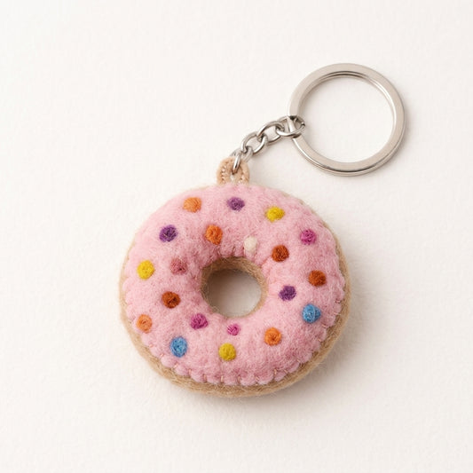  felt Pink donut keychain with colorful sprinkles on a white background