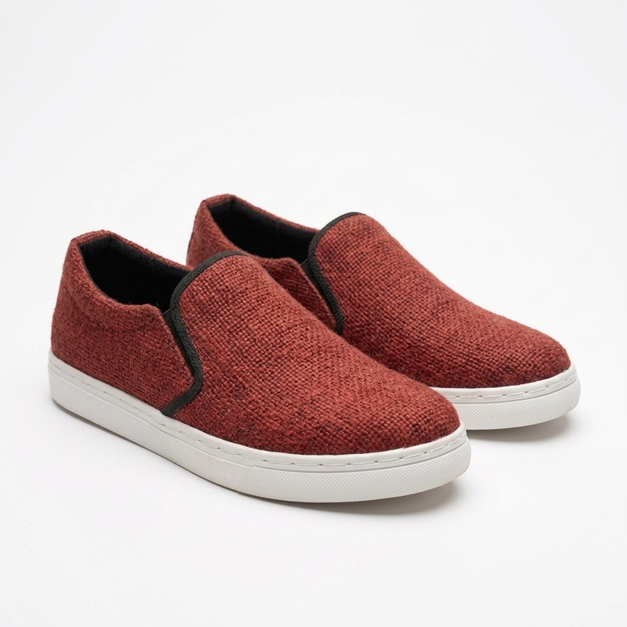 Handmade organic hemp rust-red woven slip-on sneakers with black elastic side trim and white rubber soles
