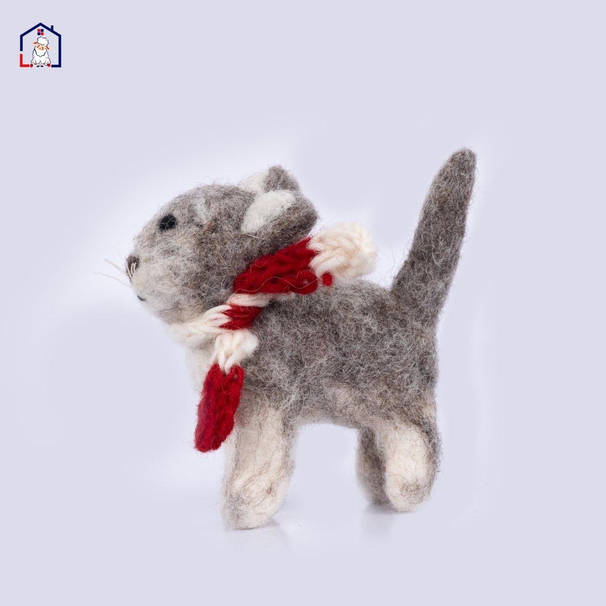 "Handmade wool felt Calico Cat Christmas ornament with orange and black patches."